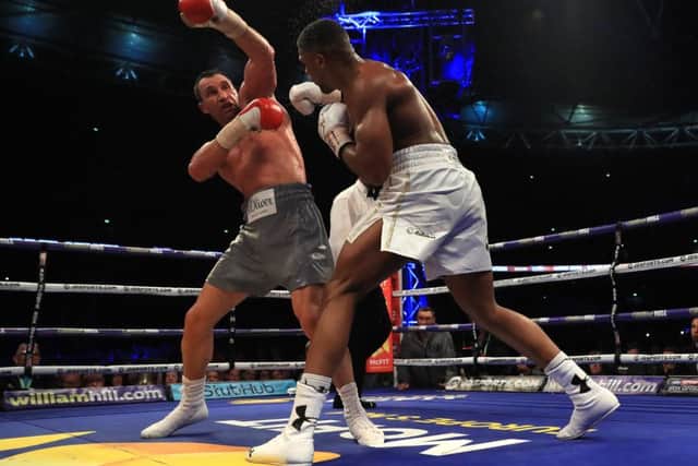 Wladimir Klitschko is on the back foot as Anthony Joshua attacks at Wembley Stadium.  Picture: Richard Heathcote/Getty Images