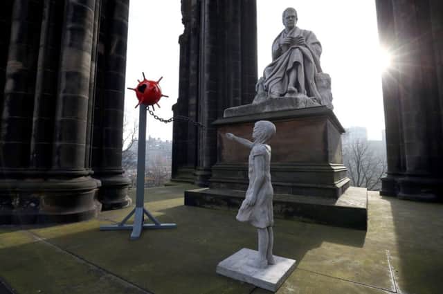 Mine Girl was erected at the Scott Monument in the dead of night for the most romantic day of the year. Picture: PA