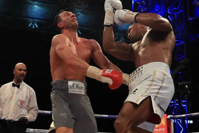 Anthony Joshua lands the decisive blow with a huge uppercut. Picture: Getty.