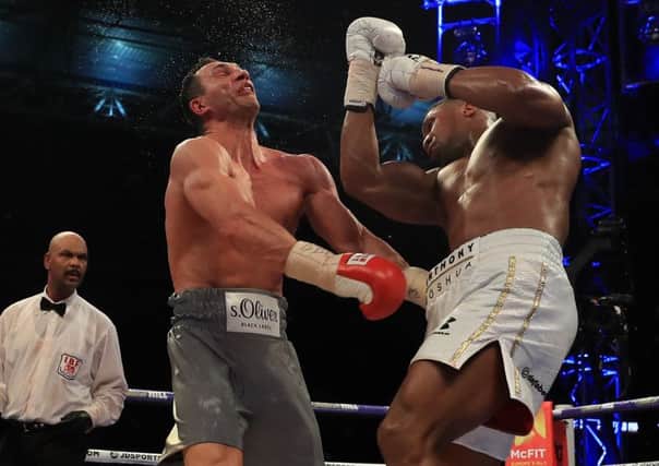 Anthony Joshua lands the decisive blow with a huge uppercut. Picture: Getty.