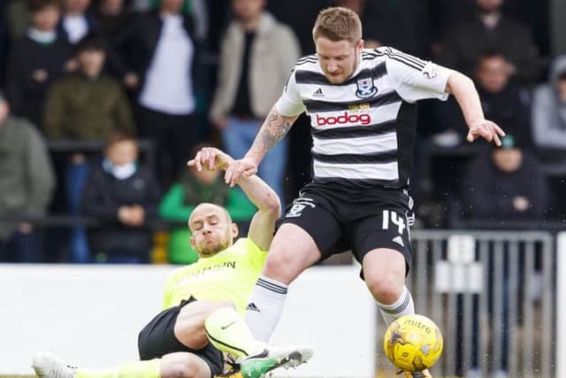 Hibs right-back David Gray slides in to tackle Ayr's Paul Cairney. Picture: SNS.