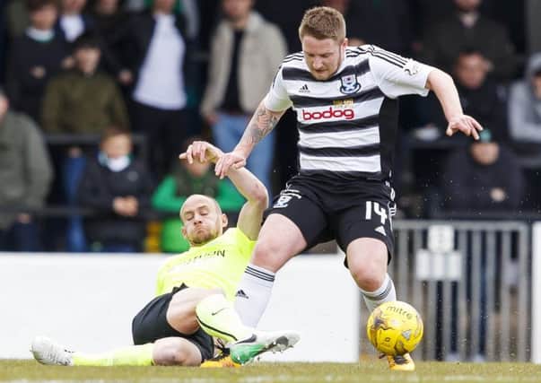Hibs right-back David Gray slides in to tackle Ayr's Paul Cairney. Picture: SNS.