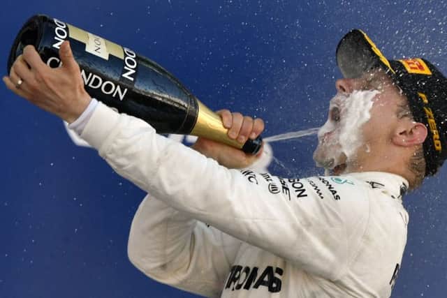 Valtteri Bottas celebrates after leading almost every lap at the Sochi Autodrom on his way to becoming the fifth Finn to win a Grand Prix. Photograph: Getty Images