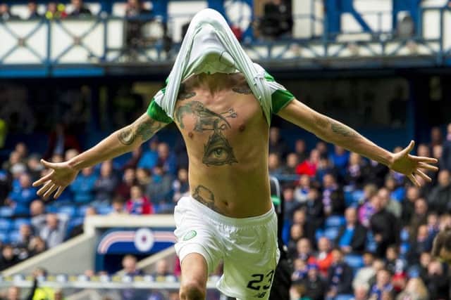 Celtics Swedish defender Mikael Lustig celebrates after scoring the fifth goal to put the final gloss on his sides comprehensive thrashing of Rangers at Ibrox. Picture: Paul Devlin/SNS