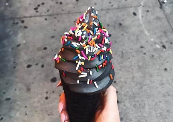 Would you sample black ice cream? Picture: Hemedia