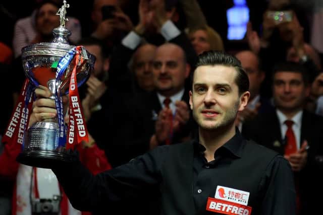 Mark Selby with the World Cham[ionship trophy after his 18-15 win over Scotland's John Higgins in the final. Picture: Warren Little/Getty Images