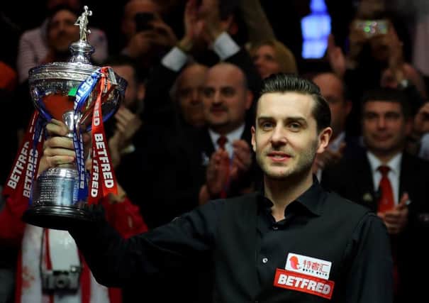 Mark Selby with the World Cham[ionship trophy after his 18-15 win over Scotland's John Higgins in the final. Picture: Warren Little/Getty Images