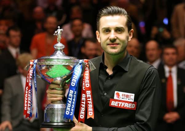 Mark Selby celebrates winning the Betfred Snooker World Championship. Picture: PA