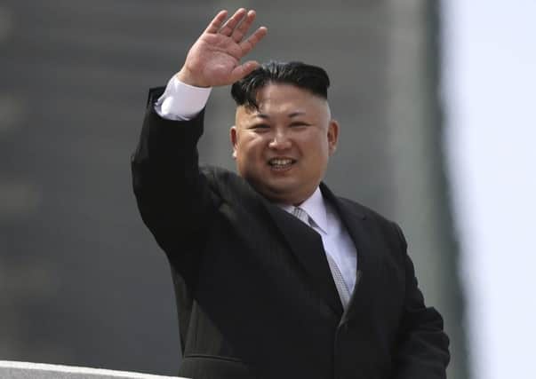 North Korean leader Kim Jong Un waves during a military parade to celebrate the 105th birth anniversary of Kim Il Sung in Pyongyang, North Korea.  (AP Photo/Wong Maye-E, File)