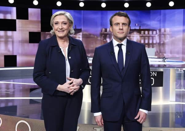 Marine Le Pen and Emmanuel Macron before the final debate. Picture: AP
