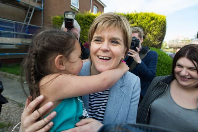 Nicola Sturgeon and SNP group leader Susan Aitken (right) met residents in Toryglen ahead of tomorrow's local authority elections, with the SNP confident of taking power in Glasgow for the first time. Picture: John Devlin/TSPL