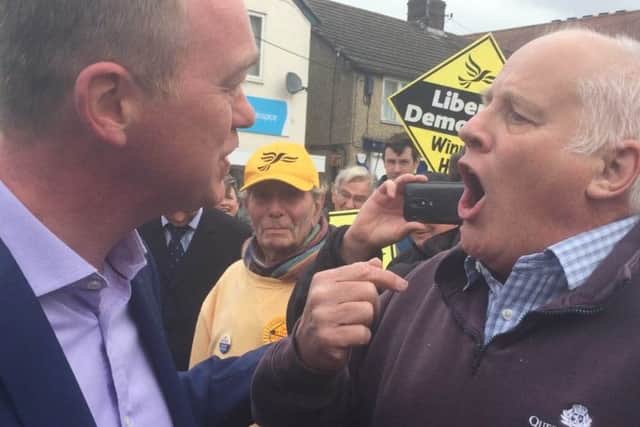 Pensioner Malcolm Baker confronts Liberal Democrat leader Tim Farron. Picture: PA