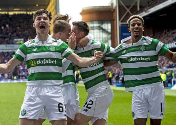 Celtic's Kieran Tierney and Scott Sinclair celebrate Callum McGregor's goal in the recent 5-1 win. Picture: SNS
