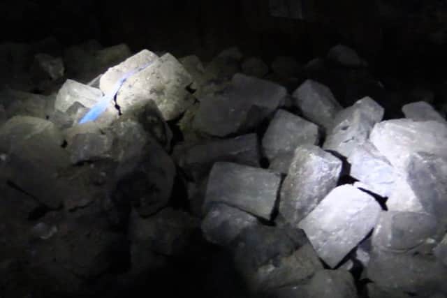 Some of the rooms are filled with thousands of granite setts.