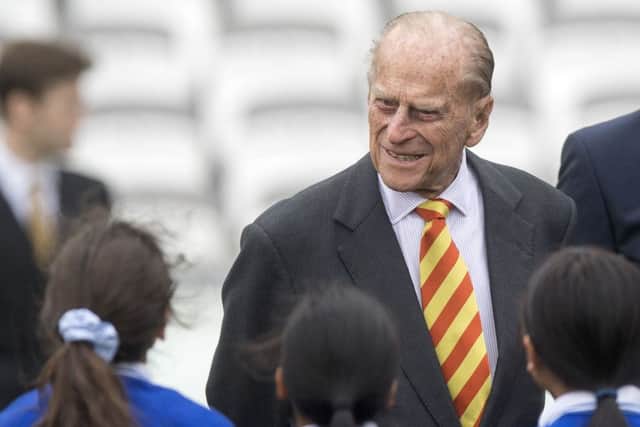 The Duke of Edinburgh talks to school children from St Edwards Catholic Primary School in London. Picture: PA