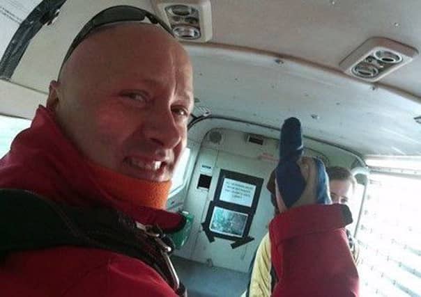 James McConnell, 69, landed in a reservoir after his
skydive near the Thai resort of Pattaya on Thursday went seriously wrong. Picture: contributed