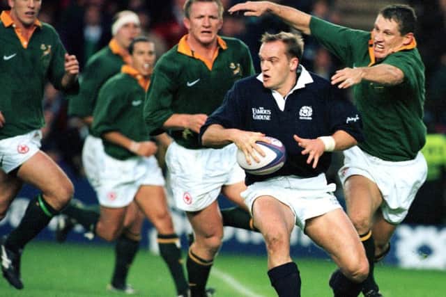 Gregor Townsend tackled by James Small while playing against South Africa in 1997, Picture: Ian Rutherford