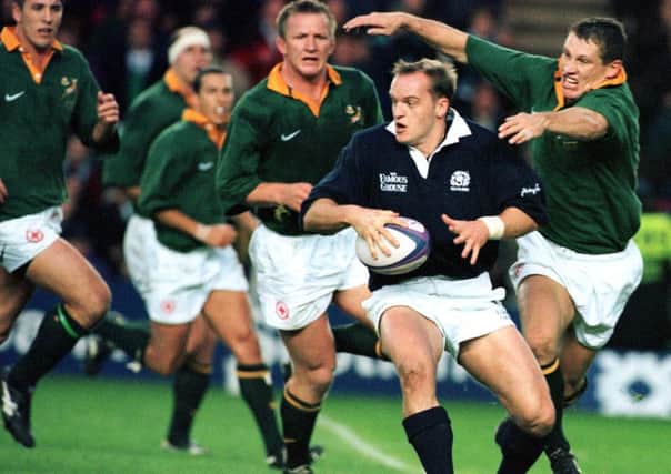 Gregor Townsend tackled by James Small while playing against South Africa in 1997, Picture: Ian Rutherford
