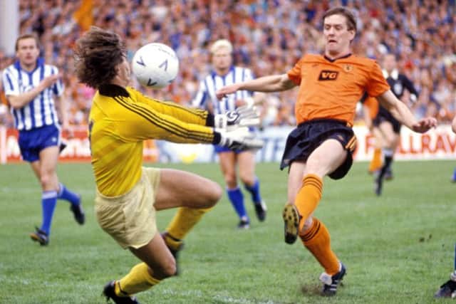 Gothenburg goalkeeper Thomas Wernersson thwarts Dundee United's Billy Kirkwood during the Tannadice leg of the 1987 Uefa Cup final. Picture: SNS