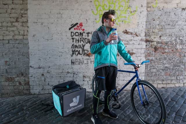Deliveroo riders have to put down a deposit for their uniforms. Picture: John Devlin