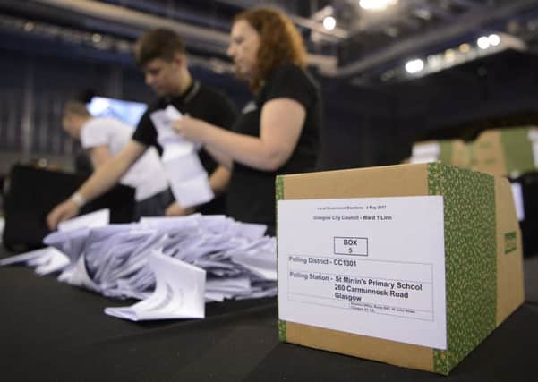 Election staff count ballot papers for the local elections at the Emirates Stadium in Glasgow. Picture: PA