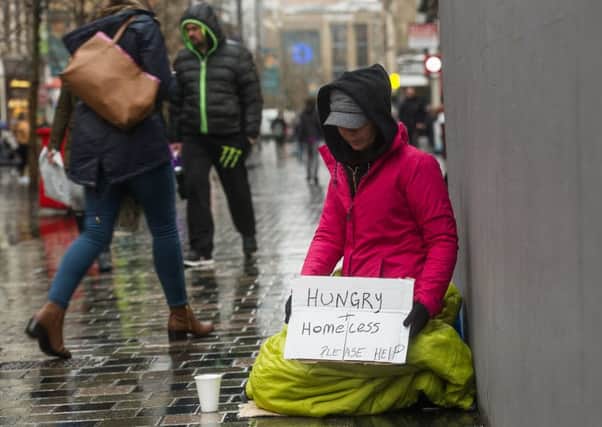 A beggar on the streets of Glasgow. Picture: John Devlin