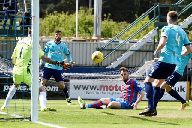 Brad McKay opens the scoring for Inverness. Pic: Paul Devlin.