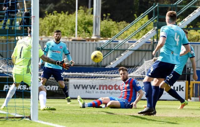 Brad McKay opens the scoring for Inverness. Pic: Paul Devlin.