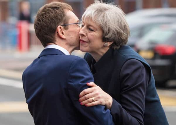 Theresa May is greeted by Mayor Andy Street during a visit to Wolverhampton yesterday. Photograph: Getty