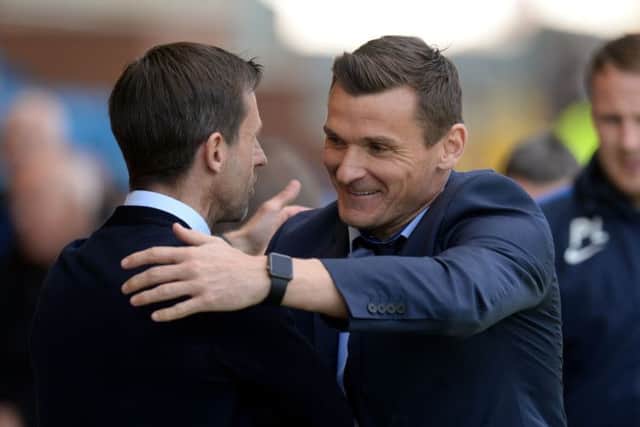 Dundee interim manager Neil McCann (left) and Kilmarnock interim manager Lee McCulloch shake hands before the game. Pic: SNS/Sammy Turner