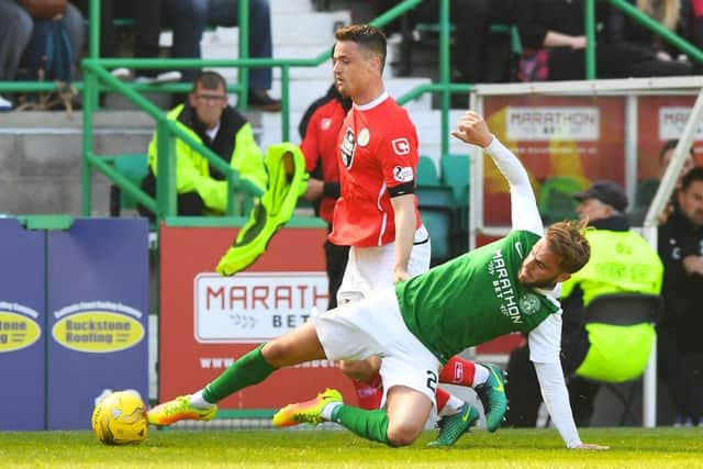 St Mirren's Stephen McGinn and Hibernian's Andrew Shinnie battle it out as the Buddies survive. Pic: SNS/Alan Harvey
