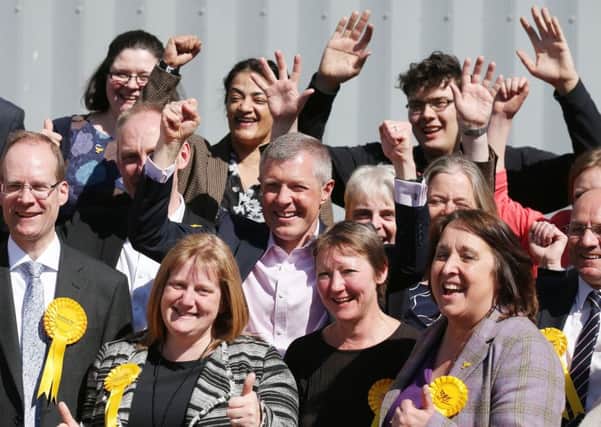 Scottish Liberal Democrat leader Willie Rennie (centre) celebrates with newly elected councilors during the local elections at Meadowbank Stadium in Edinburgh. Picture: PA