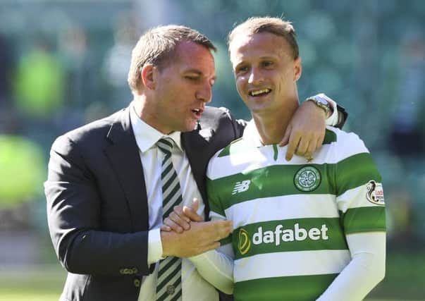 Celtic manager Brendan Rodgers (left) with Leigh Griffiths after Saturday's win over St Johnstone. Picture: SNS