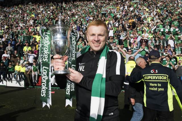 Neil Lennon beams with the Championship trophy. Pic: SNS/Alan Harvey