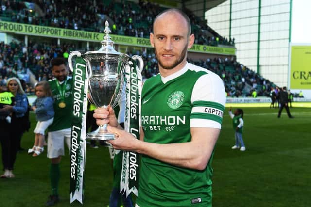 Captain, leader, legend. David Gray gets his hands round another piece of silverware at Hibs. Pic: SNS/Alan Harvey