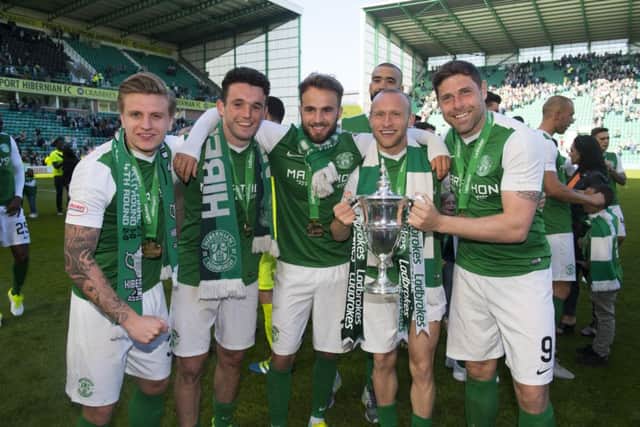 Jason Cummings, John McGinn, Andrew Shinnie, Martin Boyle and Grant Holt take in the moment as Liam Fontaine lurks in the background. Pic: SNS/Alan Harvey