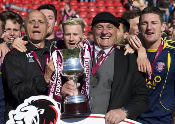 Arbroath manger Dick Campbell is all smiles after his side picked up the League Two trophy.  Photograph: Kenny Smith/SNS