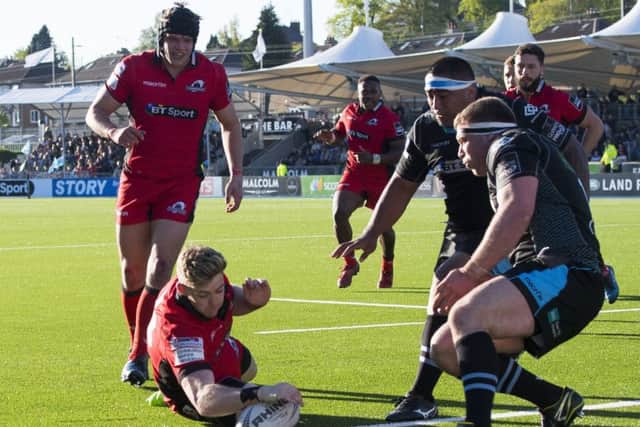 Full-back Glen Bryce dives over the line to score Edinburghs second try. Photograph: Bill Murray/SNS