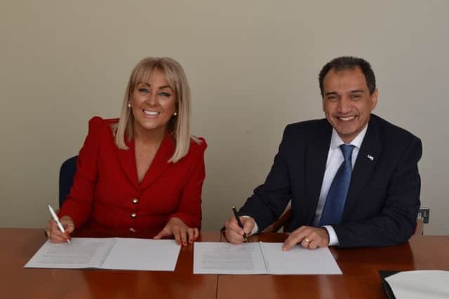 Marie Macklin and Professor Ehsan Mesbahi sign the agreement aimed at creating an innovation hub in Kilmarnock. Picture: Contributed