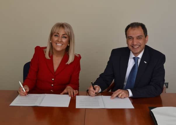 Marie Macklin and Professor Ehsan Mesbahi sign the agreement aimed at creating an innovation hub in Kilmarnock. Picture: Contributed