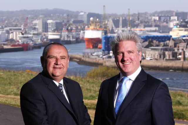 Coltel managing director Neil Collie, left, with Connect boss Scott Ritchie. Picture: Simon Price