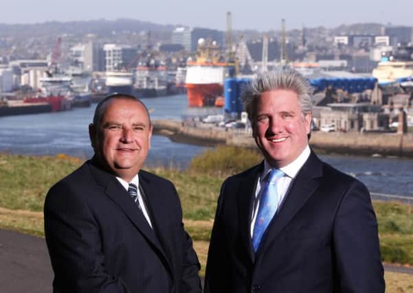 Coltel managing director Neil Collie, left, with Connect boss Scott Ritchie. Picture: Simon Price