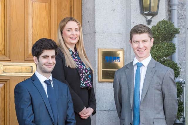Deborah May with fellow KPMG recruits David Mubarak, left, and Chris Harvey. Picture: Graham Dargie