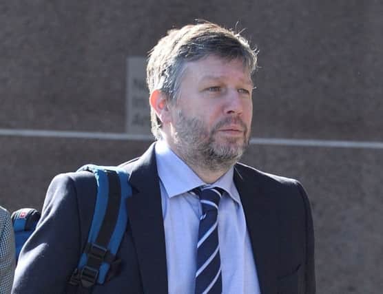 Ex finance director at the Wheatley Group Mark Logan  arrives at Glasgow Sheriff Court. Picture: SWNS