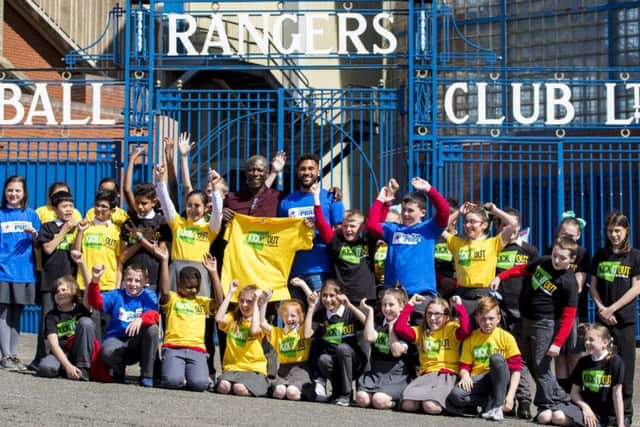 Wes Foderingham and Paul Mortimer with pupils of St Saviours Primary School, where Kick it Out held an anti-discrimination workshop.