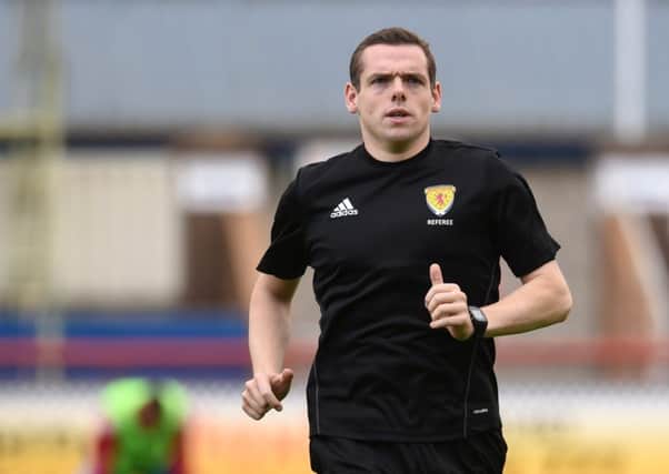 MSP Douglas Ross in action as a referee.