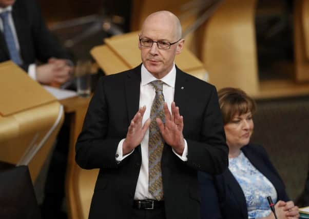 Education secretary John Swinney has urged lecturers to call off planned industrial action. Picture: Russell Cheyne/PA Wire