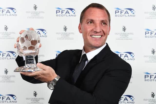 Celtic manager Brendan Rodgers with his manager-of-the-year award.