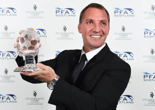 Celtic manager Brendan Rodgers with his manager-of-the-year award.