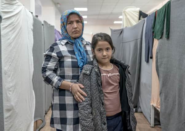 Hakima Hussein, 33, and her daughter, Zahara, 7, travelled from Iran and are now living in Presevo refugee camp in southern Serbia. Picture: Andrew Testa/Christian Aid